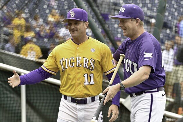 TCU coach Jim Schlossnagle, right, jokes with LSU's hitting coach Andy Cannizaro (11) during team practice at TD Ameritrade Park in Omaha, Neb., Friday, June 12, 2015. TCU plays LSU in an NCAA College World Series baseball game on Sunday. (AP Photo/Mike Theiler)