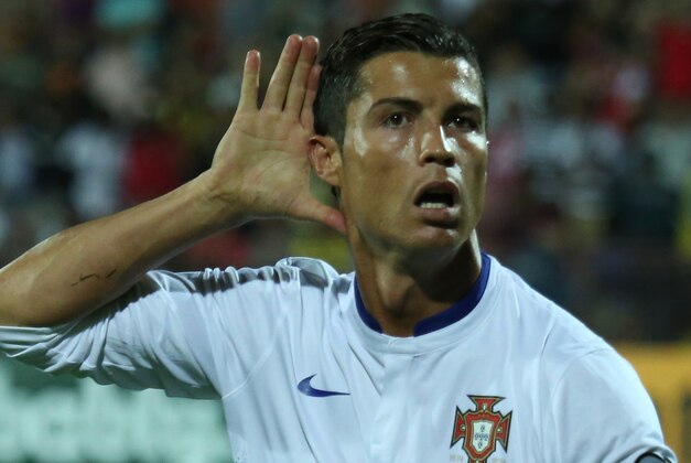 Portugal's Cristiano Ronaldo gestures after scoring the second goal during the Euro 2016 Group I qualifying match between Armenia and Portugal in Yerevan, Armenia, Saturday, June 13, 2015. (Hrant Khachatryan/PAN Photo via AP)