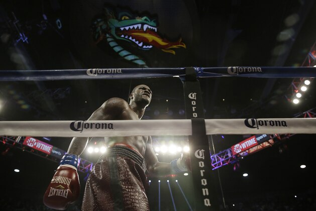 Deontay Wilder walks around the ring during the bout against Eric Molina during the WBC heavyweight boxing match, Saturday, June 13, 2015, in Birmingham, Ala. (AP Photo/Brynn Anderson)