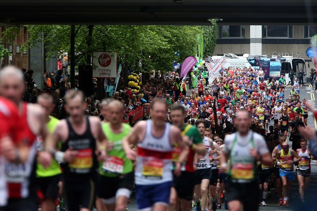 LONDON, ENGLAND - APRIL 26:  Runners make their way through Canary Wharf during the Virgin Money London Marathon on April 26, 2015 in London, England.  (Photo by Ben Hoskins/Getty Images)