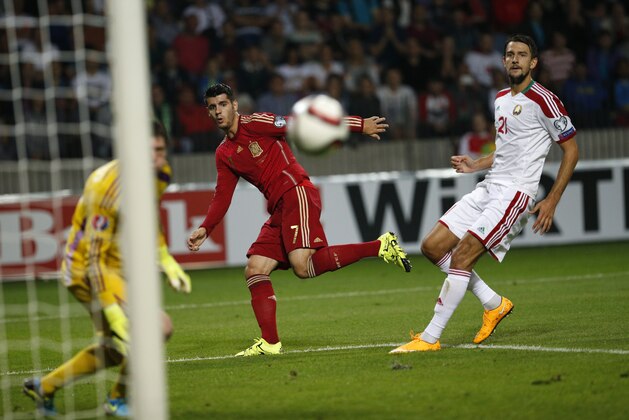 Spain’s Alvaro Morata, center, falls to score against Belarus during their Euro 2016 qualifying soccer match at the Borisov-Arena stadium, in Borisov, Belarus, Sunday, June 14, 2015. (AP Photo/Sergei Grits)
