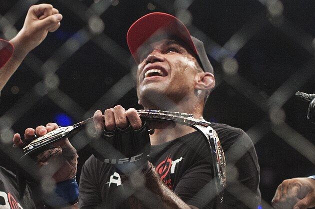 Brazil´s Fabricio Werdum celebrates after beating United States´ Cain Velasquez in a men's mixed martial arts UFC 188 heavyweight title fight in Mexico City, Saturday, June  13, 2015. Werdum won the fight by submission. (AP Photo/Christian Palma)