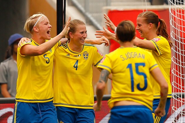 WINNIPEG, MB - JUNE 08:  Nilla Fischer #5 of Sweden reacts after scoring the second goal against Nigeria with Emma Berglund #4, Therese Sjogran #15, and Lotta Schelin #8 during the FIFA Women's World Cup Canada 2015 Group D match between Sweden and Nigeria at Winnipeg Stadium on June 8, 2015 in Winnipeg, Canada.  (Photo by Kevin C. Cox/Getty Images)