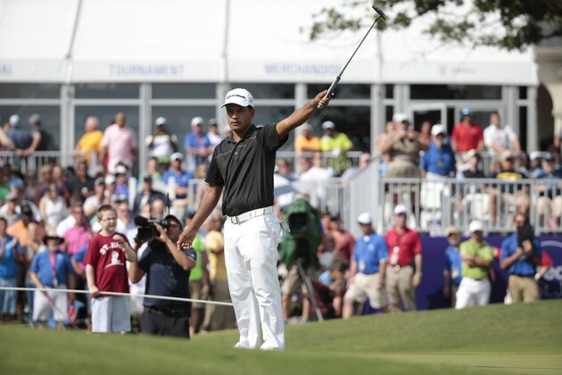 Fabian Gomez, of Argentina, celebrates his birdie putt on the 18th green to win the St. Jude Classic golf tournament Sunday, June 14, 2015, in Memphis, Tenn. Gomez won with a 13-under-par 267. (AP Photo/Mark Humphrey)