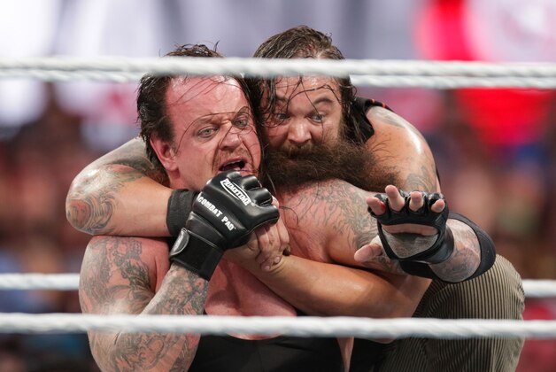Bray Wyatt keeps his opponent The Undertaker in a hold at Wrestlemania XXXI, on Sunday, March 29, 2015 in Santa Clara, CA. 2015 marks the first year Wrestlemania will be held in the San Francisco Bay Area, being made available to viewers in 177 countries via the WWE Network. (Don Feria/AP Images for WWE)