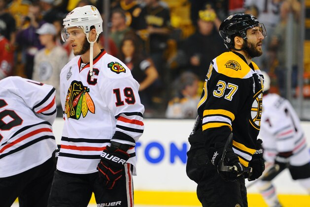 BOSTON, MA - JUNE 24 : Jonathan Toews #19 of the Chicago Blackhawks and Patrice Bergeron #37 of the Boston Bruins skate during warm ups prior to Game Six of the Stanley Cup Final at TD Garden on June 24, 2013 in Boston, Massachusetts. (Photo by Brian Babineau/NHLI via Getty Images)