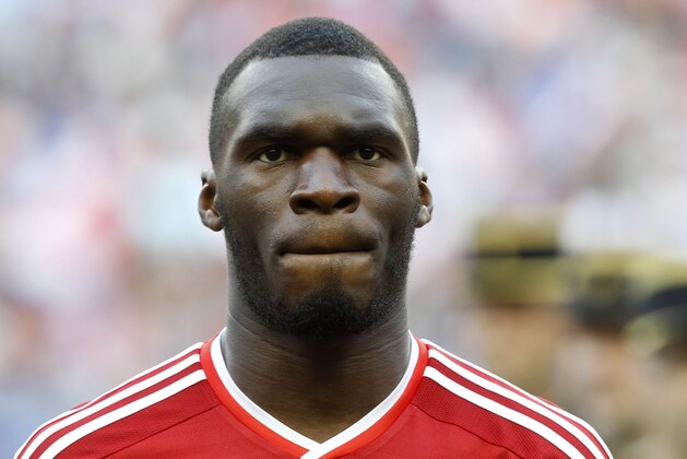 Belgium's Christian Benteke stands for the national anthem prior to the international friendly soccer match between France and Belgium at the Stade de France, north of Paris, France, Sunday, June 7, 2015. (AP Photo/Michel Spingler)