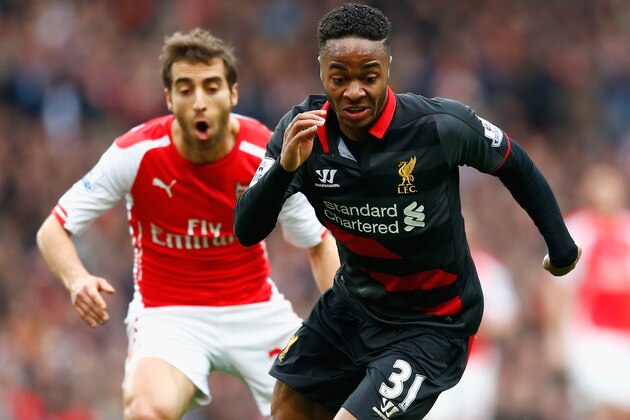 LONDON, ENGLAND - APRIL 04:  Raheem Sterling of Liverpool goes past Mathieu Flamini of Arsenal during the Barclays Premier League match between Arsenal and Liverpool at the Emirates Stadium on April 4, 2015 in London, England.  (Photo by Julian Finney/Getty Images)