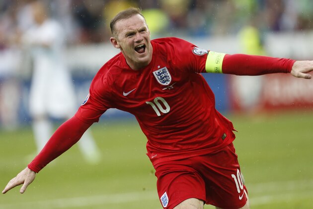 England's Wayne Rooney celebrates his goal during the Euro 2016 Group E qualifying soccer match between Slovenia and England, in Ljubljana, Slovenia, Sunday, June 14, 2015. (AP Photo/Darko Bandic)