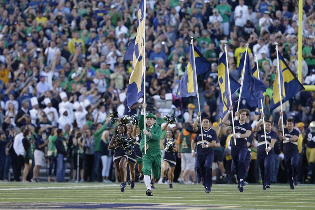 The Notre Dame takes the field before an NCAA college football game against between Notre Dame and Michigan in South Bend, Ind., Saturday, Sept. 6, 2014. (AP Photo/Michael Conroy)