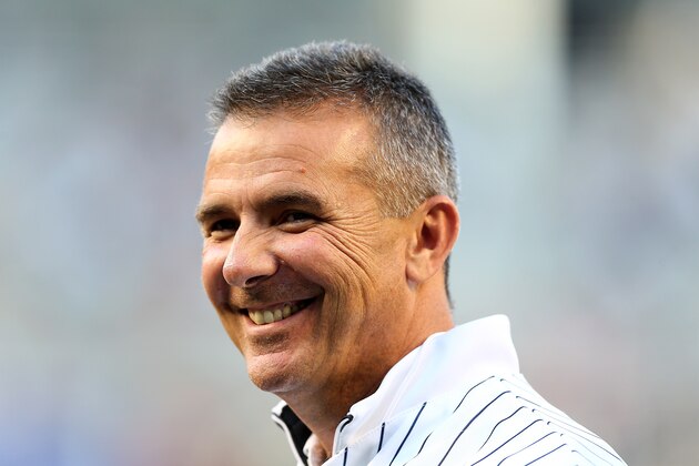 NEW YORK, NY - MAY 08:  Ohio State football coach Urban Meyer stands on the field before he threw out ceremonial first pitch before the game between the New York Yankees and the Baltimore Orioles on May 8, 2015 at Yankee Stadium in the Bronx borough of New York City.  (Photo by Elsa/Getty Images)