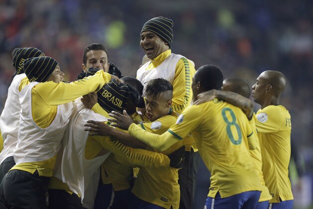 Brazil's Neymer, center, celebrates with his teammates after Brazil's Douglas Costa scored his team's second goal during a Copa America Group C soccer match at the Bicentenario German Becker stadium in Temuco, Chile, Sunday, June 14, 2015. (AP Photo/Jorge Saenz)