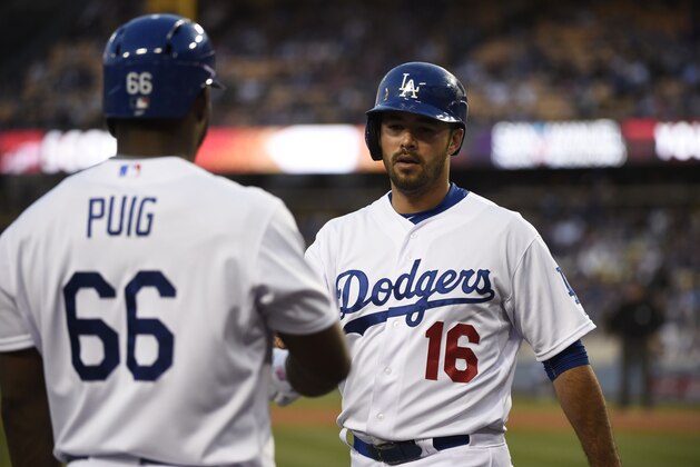 Jun 10, 2015; Los Angeles, CA, USA; Los Angeles Dodgers right fielder Andre Ethier (16) is congratulated by Los Angeles Dodgers right fielder Yasiel Puig (66) after scoring in the second inning against the Los Angeles Dodgers during the game at Dodger Stadium. Mandatory Credit: Richard Mackson-USA TODAY Sports