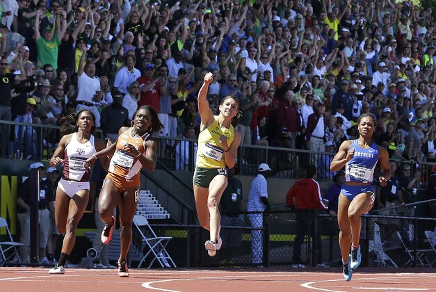 Oregon's Jenna Prandini celebrates after winning the women's 100 meters during the NCAA track and field championships in Eugene, Ore., Saturday, June 13, 2015.  From left are Texas A&M's Aaliyah Brown, Texas's Morolake Akinosun, Prandini, and Kentucky's Dezerea Bryant. (AP Photo/Don Ryan)