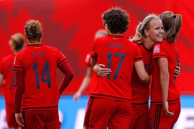 WINNIPEG, MB - JUNE 15:  Lena Petermann #19 of Germany reacts after their 4-0 win over Thailand with Josephine Henning #17 and Melanie Leupolz #16 after the FIFA Women's World Cup Canada 2015 match between Thailand and Germany at Winnipeg Stadium on June 15, 2015 in Winnipeg, Canada.  (Photo by Kevin C. Cox/Getty Images)
