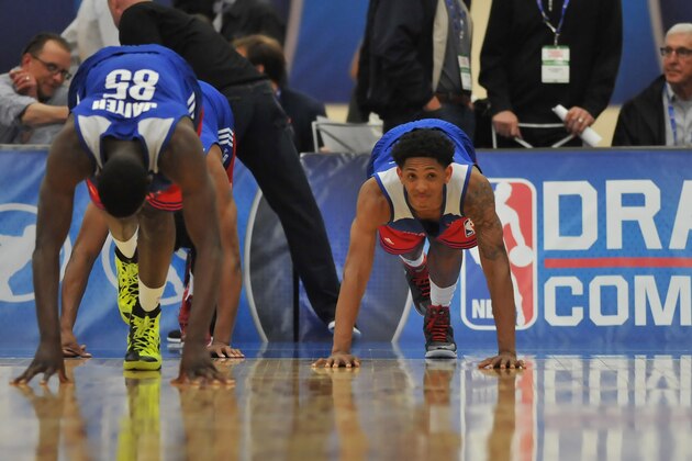 CHICAGO, IL - MAY 14:  Mouhammadou Jaiteh #85 and Cameron Payne #4 complete a stretching drill during the 2015 NBA Draft Combine on May 14, 2015 at Quest Multiplex in Chicago, Illinois. NOTE TO USER: User expressly acknowledges and agrees that, by downloading and/or using this photograph, user is consenting to the terms and conditions of the Getty Images License Agreement.  Mandatory Copyright Notice: Copyright 2013 NBAE (Photo by Randy Belice/NBAE via Getty Images)