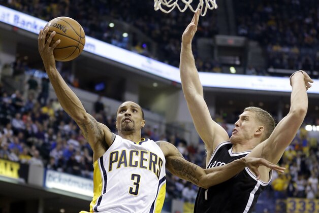 Indiana Pacers guard George Hill (3) shoots over Brooklyn Nets center Mason Plumlee (1) during the second half of an NBA basketball game in Indianapolis, Saturday, March 21, 2015. The Nets defeated the Pacers 123-111. (AP Photo/Michael Conroy)