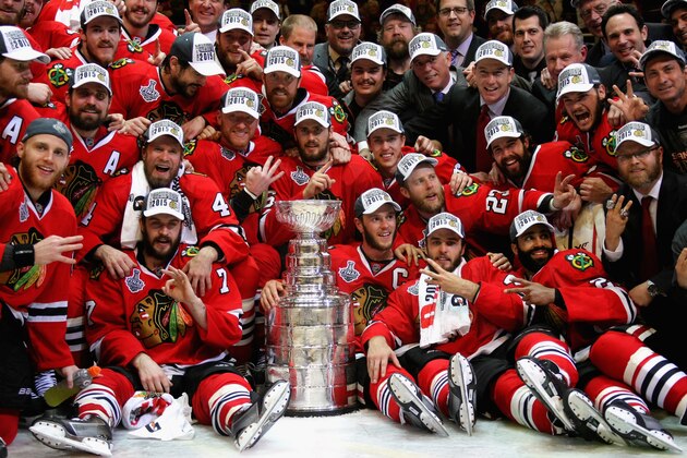 CHICAGO, IL - JUNE 15:  The Chicago Blackhawks pose with the Stanley Cup after defeating the Tampa Bay Lightning 2-0 in Game Six to win the 2015 NHL Stanley Cup Final at the United Center on June 15, 2015 in Chicago, Illinois.  (Photo by Dave Sandford/NHLI via Getty Images)
