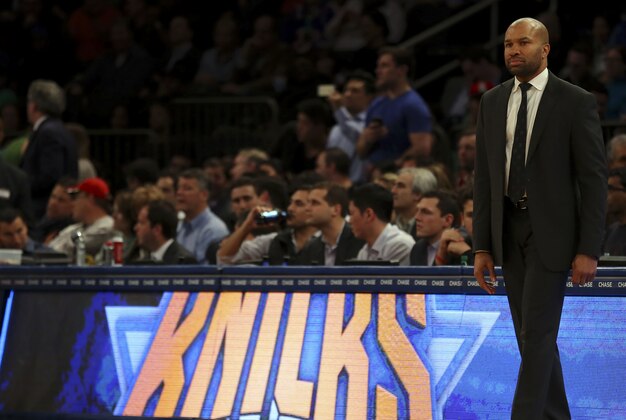 Mar 17, 2015; New York, NY, USA; New York Knicks head coach Derek Fisher looks on against the San Antonio Spurs during the second half at Madison Square Garden. The Knicks defeated the Spurs 104 - 100 in overtime. Mandatory Credit: Adam Hunger-USA TODAY Sports