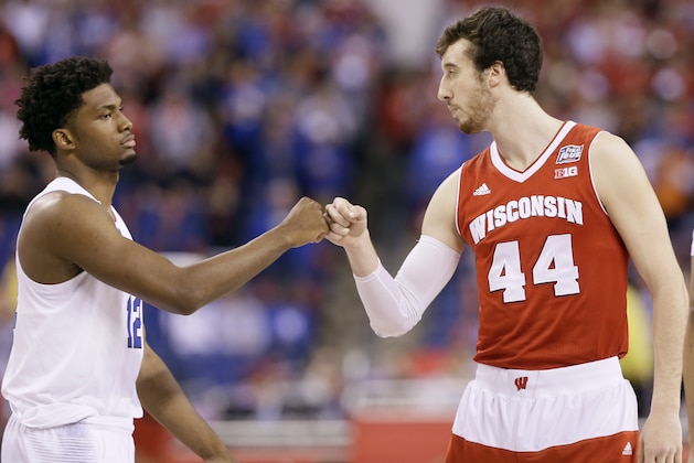 Duke's Justise Winslow, left, greets Wisconsin's Frank Kaminsky at the start of the NCAA Final Four college basketball tournament championship game Monday, April 6, 2015, in Indianapolis. (AP Photo/Charlie Neibergall)