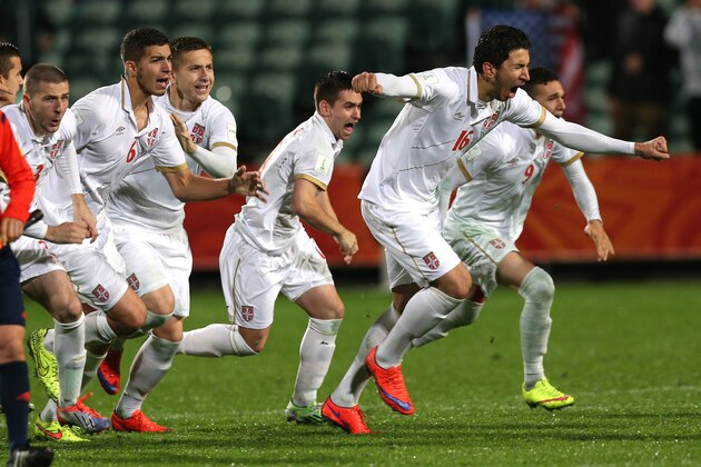 Serbian player's celebrate after defeating the US in a penalty shoot out during their U20 soccer World Cup quarterfinal game in Auckland, New Zealand, Sunday, June 14, 2015. (AP Photo/David Rowland)