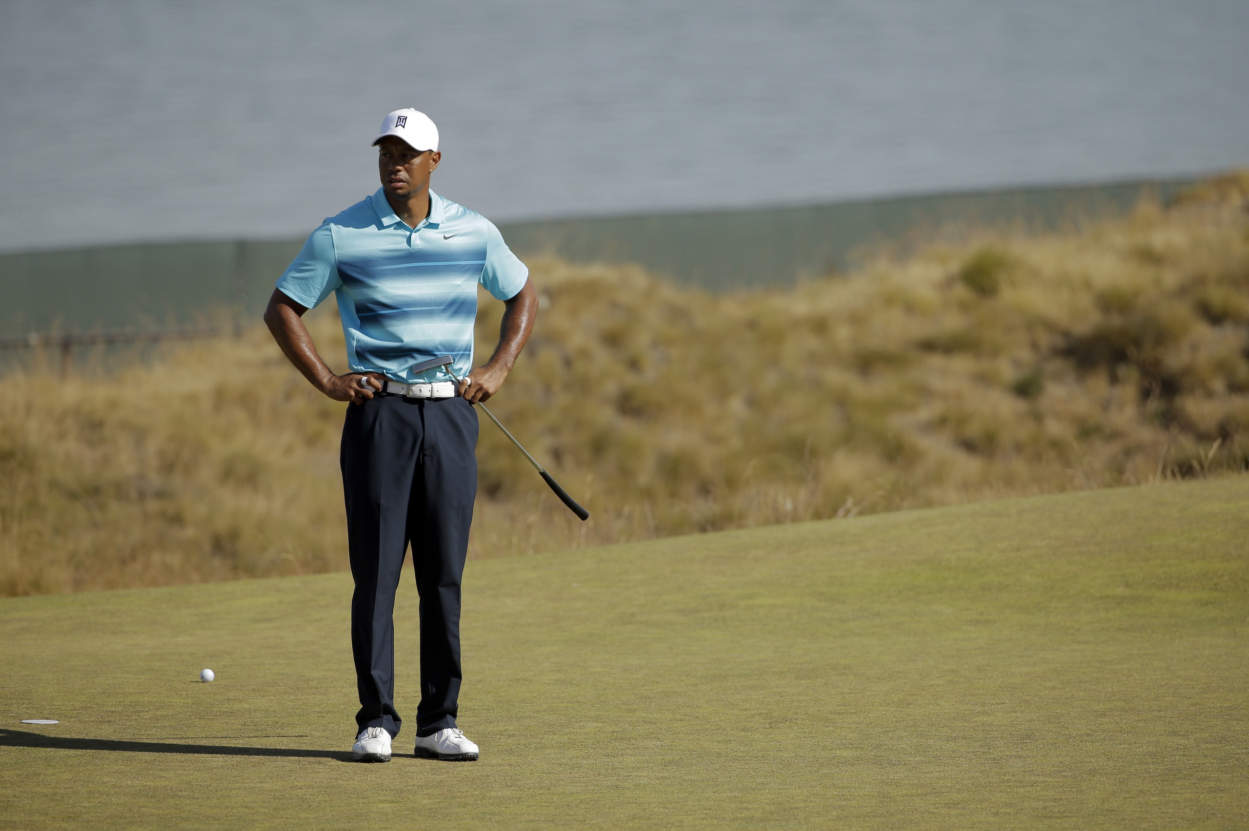 Tiger Woods stands on the 18th green during a practice round for the U.S. Open golf tournament at Chambers Bay on Monday, June 15, 2015, in University Place, Wash. (AP Photo/Ted S. Warren)