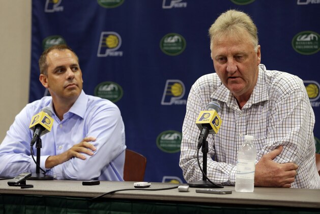 Indiana Pacers President of Basketball Operations Larry Bird, right,  and head coach Frank Vogel talk about the injury to player Paul George during a press conference in Indianapolis, Tuesday, Aug. 12, 2014. (AP Photo/Michael Conroy)