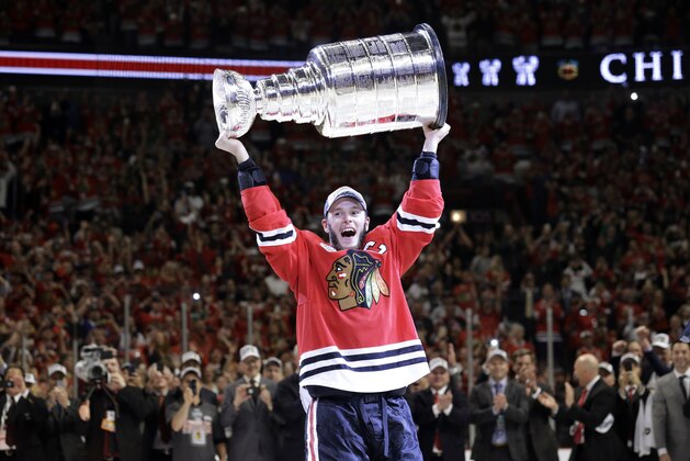 Chicago Blackhawks’ Jonathan Toews hoists the Stanley Cup after defeating the Tampa Bay Lightning in Game 6 of the NHL hockey Stanley Cup Final series on Wednesday, June 10, 2015, in Chicago. The Blackhawks defeated the Lightning 2-0 to win the series 4-2.  (AP Photo/Nam Y. Huh)