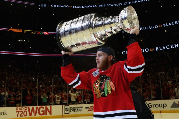 CHICAGO, IL - JUNE 15:  Patrick Kane #88 of the Chicago Blackhawks lifts the Stanley Cup in celebration after his team defeated the Tampa Bay Lightning 2-0 in Game Six of the 2015 NHL Stanley Cup Final at the United Center on June 15, 2015 in Chicago, Illinois.  (Photo by Dave Sandford/NHLI via Getty Images)