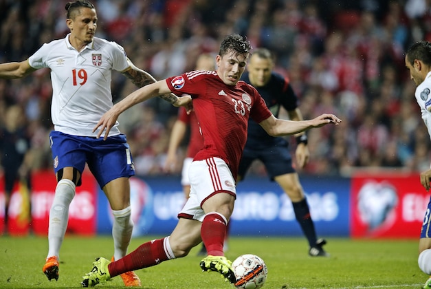 Denmarks's Pierre Hojbjerg, right, and Serbia's Ljubomir Fejsa, left, battle for the ball during the Euro 2016 Group I qualifying soccer match at Parken stadium in Copenhagen, Saturday June 13, 2015. (Jens Dresling/POLFOTO via AP) DENMARK OUT
