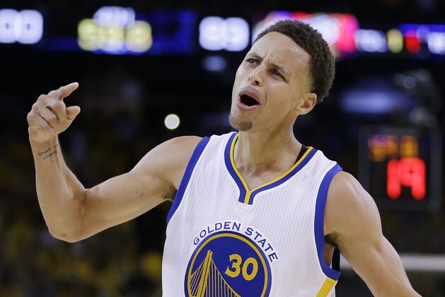 Golden State Warriors guard Stephen Curry (30) celebrates during the second half of Game 5 of basketball's NBA Finals against the Cleveland Cavaliers in Oakland, Calif., Sunday, June 14, 2015. The Warriors won 104-91. (AP Photo/Ben Margot)