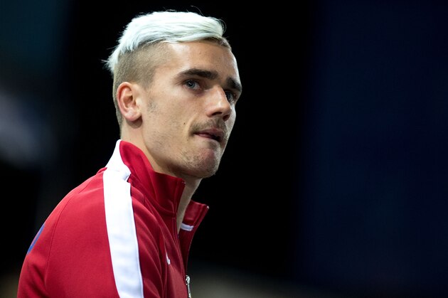 MADRID, SPAIN - MARCH 17:  Antoine Griezmann bites his tongue as he enters the pitch prior to start the UEFA Champions League round of 16 second leg match between Club Atletico de Madrid and Bayer 04 Leverkusen at Vicente Calderon Stadium on March 17, 2015 in Madrid, Spain.  (Photo by Gonzalo Arroyo Moreno/Getty Images)