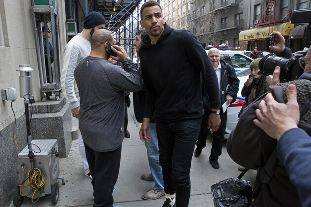 Atlanta Hawks NBA basketball players Thabo Sefolosha, center, and Pero Antic, back left, leave a courthouse in New York, Wednesday, April 8, 2015. The players have been released after their arrest on charges they blocked officers from setting up a crime scene following the stabbing of Indiana Pacers' Chris Copeland. (AP Photo/Craig Ruttle)