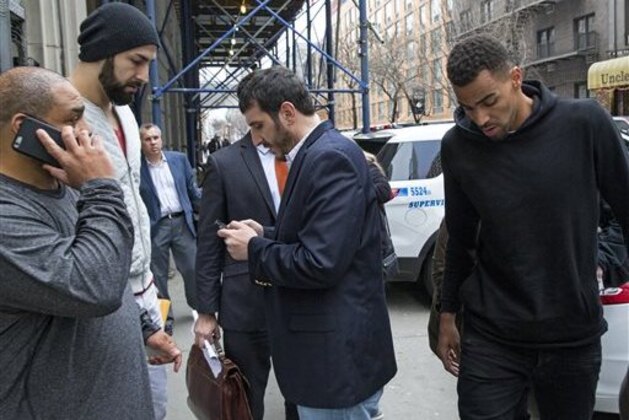 Atlanta Hawks NBA basketball players Pero Antic, left, in hat, and Thabo Sefolosha, right, leave a courthouse in New York, Wednesday, April 8, 2015. The players have been released after their arrest on charges they blocked officers from setting up a crime scene following the stabbing of Indiana Pacers' Chris Copeland. (AP Photo/Craig Ruttle)
