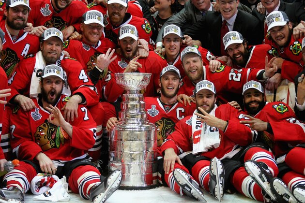 CHICAGO, IL - JUNE 15:  The Chicago Blackhawks pose with the Stanley Cup after defeating the Tampa Bay Lightning 2-0 in Game Six to win the 2015 NHL Stanley Cup Final at the United Center on June 15, 2015 in Chicago, Illinois.  (Photo by Dave Sandford/NHLI via Getty Images)