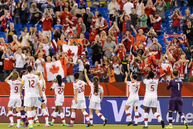 MONTREAL, QC - JUNE 15:  Team Canada acknowledges the fans during the 2015 FIFA Women's World Cup Group A match against the Netherlands at Olympic Stadium on June 15, 2015 in Montreal, Quebec, Canada.  Final score between Canada and the Netherlands 1-1. (Photo by Minas Panagiotakis/Getty Images)