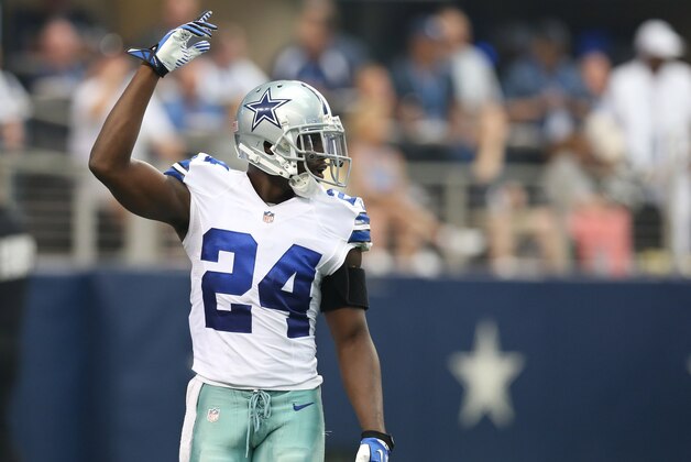 Sep 22, 2013; Arlington, TX, USA; Dallas Cowboys cornerback Morris Claiborne (24) wears a shoulder harness as he motions to get the crowd louder against the St. Louis Rams at AT&T Stadium. Mandatory Credit: Matthew Emmons-USA TODAY Sports