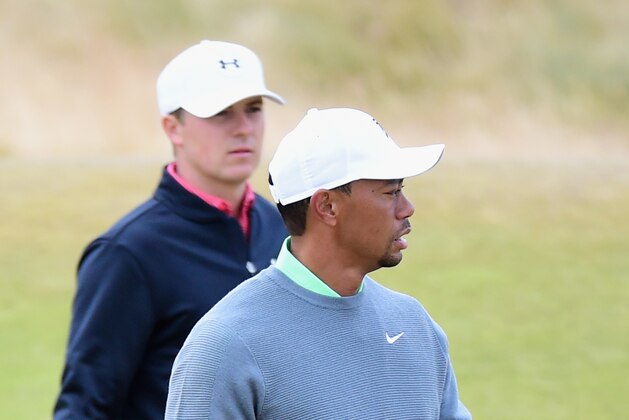 UNIVERSITY PLACE, WA - JUNE 16:  (L-R) Jordan Spieth of the United States and Tiger Woods of the United States walk across a green during a practice round prior to the start of the 115th U.S. Open Championship at Chambers Bay on June 16, 2015 in University Place, Washington.  (Photo by Harry How/Getty Images)