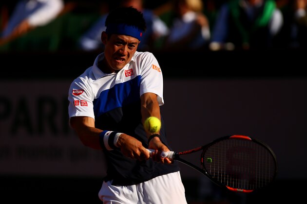 PARIS, FRANCE - JUNE 02:  Kei Nishikori of Japan returns a shot during his men's singles match against Jo-Wilfried Tsonga of France on day of the 2015 French Open at Roland Garros on June 2, 2015 in Paris, France.  (Photo by Dan Istitene/Getty Images)