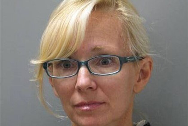 FILE - In this undated file photo provided Wednesday, Nov. 5, 2014 by the Delaware State Police, Molly Shattuck, of Baltimore, poses for a police mug shot. The former Baltimore Ravens cheerleader charged with raping a teenage boy and providing other minors with alcohol is set for a court hearing Wednesday Jan. 7, 2015. (AP Photo/Delaware State Police, File)