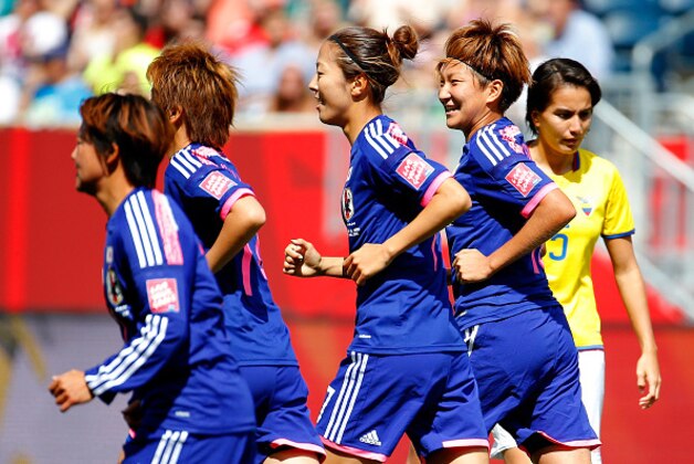 WINNIPEG, MB - JUNE 16:  Yuki Ogimi #17 of Japan celebrates her goal against Ecuador with Yuika Sugasawa #15 during the FIFA Women's World Cup Canada 2015 Group C match between Ecuador and Japan at Winnipeg Stadium on June 16, 2015 in Winnipeg, Canada.  (Photo by Kevin C. Cox/Getty Images)