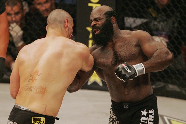 Kimbo Slice, right, throws a punch at James Thompson of Manchester, England during the first round of their EliteXC heavyweight bout at the Prudential Center in Newark, N.J. Saturday, May 31, 2008. Slice won in the third round on a TKO. (AP Photo/Rich Schultz)