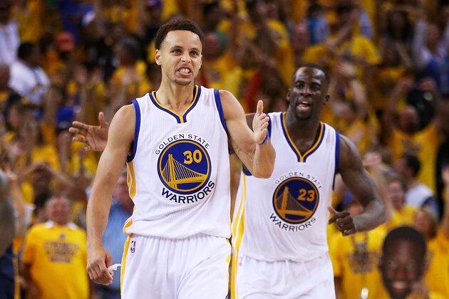 OAKLAND, CA - JUNE 14:  Stephen Curry #30 celebrates with Draymond Green #23 of the Golden State Warriors in the fourth quarter against the Cleveland Cavaliers during Game Five of the 2015 NBA Finals at ORACLE Arena on June 14, 2015 in Oakland, California. NOTE TO USER: User expressly acknowledges and agrees that, by downloading and or using this photograph, user is consenting to the terms and conditions of Getty Images License Agreement.  (Photo by Ezra Shaw/Getty Images)