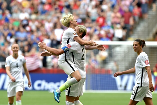 VANCOUVER, BC - JUNE 16:  Abby Wambach #20 of the United States celebrates with Megan Rapinoe #15 after Wambach scores a goal in the first half against Nigeria in the Group D match of the FIFA Women's World Cup Canada 2015 at BC Place Stadium on June 16, 2015 in Vancouver, Canada.  (Photo by Rich Lam/Getty Images)