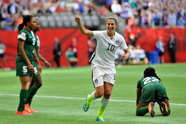 VANCOUVER, BC - JUNE 16:  Carli Lloyd #10 celebrates after teammate Abby Wambach #20 of the United States scores a goal in the first half against Nigeria in the Group D match of the FIFA Women's World Cup Canada 2015 at BC Place Stadium on June 16, 2015 in Vancouver, Canada.  (Photo by Rich Lam/Getty Images)