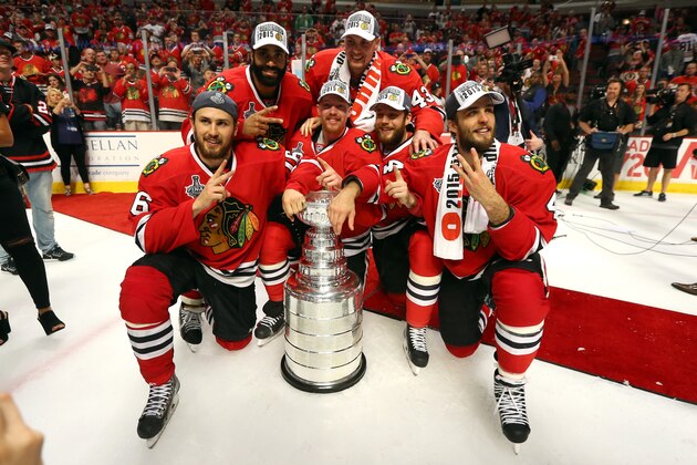 CHICAGO, IL - JUNE 15:  Swedish players Johnny Oduya #27, Viktor Svedberg #43, Marcus Kruger #16, Joakim Nordstrom #42, David Rundblad #5 and Niklas Hjalmarsson #4 of the Chicago Blackhawks pose with the Stanley Cup after defeating the Tampa Bay Lightning  by a score of 2-0 in Game Six to win the 2015 NHL Stanley Cup Final at the United Center  on June 15, 2015 in Chicago, Illinois.  (Photo by Bruce Bennett/Getty Images)