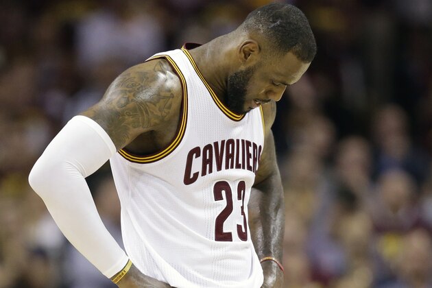 Cleveland Cavaliers forward LeBron James (23) hangs his head during the second half of Game 6 of basketball's NBA Finals against the Golden State Warriors in Cleveland, Tuesday, June 16, 2015. (AP Photo/Tony Dejak)