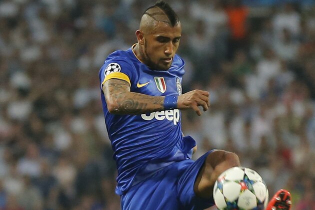 Juventus' Arturo Vidal controls the ball during the Champions League second leg semifinal soccer match between Real Madrid and Juventus, at the Santiago Bernabeu stadium in Madrid, Wednesday, May 13, 2015. The match ended in a 1-1 draw, Juventus won on aggregate and will play Barcelona in the Champions League final on June 6, 2015 in Berlin. (AP Photo/Daniel Ochoa de Olza)
