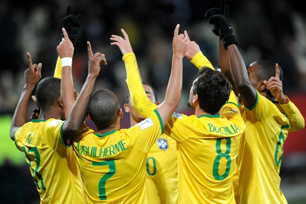 Brazilian team players celebrate after scoring their fifth goal against Senegal during their U20 soccer World Cup semifinal game in Christchurch, New Zealand, Wednesday, June 17, 2015. (AP Photo/Ross Setford)