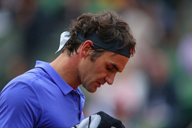 PARIS, FRANCE - MAY 31:  Roger Federer of Switzerland looks on in his Men's Singles match against Gael Monfils of France on day eight of the 2015 French Open at Roland Garros on May 31, 2015 in Paris, France.  (Photo by Clive Brunskill/Getty Images)
